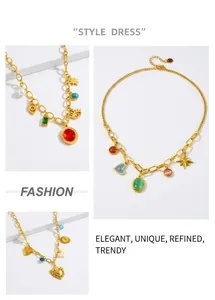 Detailed macro view of gold-tone chains with colorful gemstone pendants and star charms