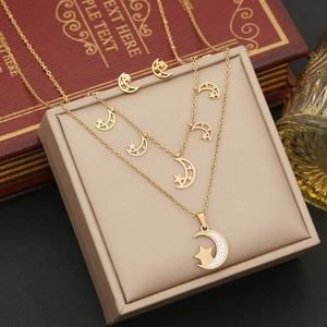 Parure bijoux dorée double chaîne lune et étoiles avec collier et boucles d'oreilles
