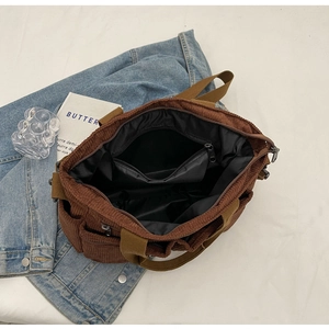 Top view of brown corduroy tote bag showing spacious interior with black lining and pocket