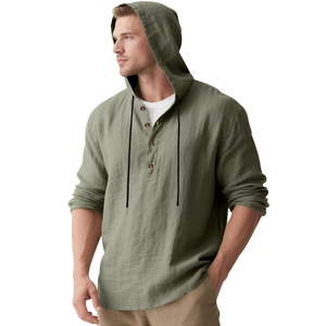 Detail of olive green linen hooded shirt with four buttons and black drawstrings