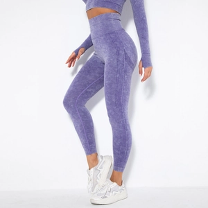 Detail view of purple acid wash seamless yoga pants highlighting high waist and peach lift effect