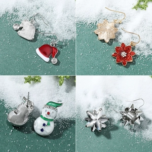 Christmas stud earring set featuring reindeer, snowman, and star motifs on a green background