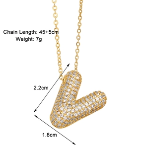 Detail view of gold letter V necklace pendant with zircon stones and sizing info