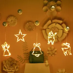 Set of five warm white LED Christmas suction cup lights featuring star and reindeer designs