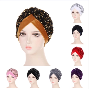 Detailed view of multi-color velvet turban hats with sparkling sequins and embroidery