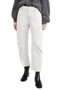 Detail of high-waist cargo jeans with structural knee seams and utility side pockets