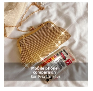 Macro detail of luxury gold evening clutch bag with sparkling rhinestones and chain strap
