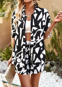 Detail of black and white geometric print shorts with drawstring and elastic waist
