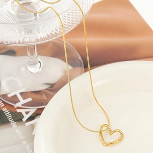 Minimalist gold plated hollow heart pendant necklace with sleek snake chain for women