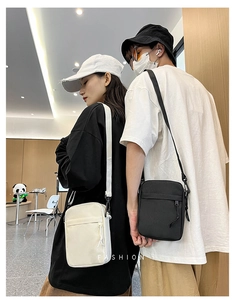 Lifestyle view of men's casual crossbody bags in beige and black nylon fabric