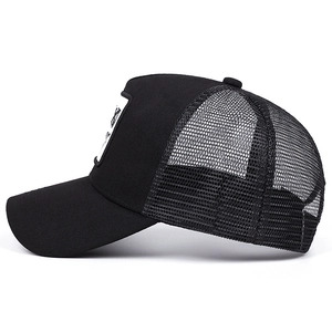 Classic black trucker hat with mesh back and animal embroidery patch on a curved brim cap