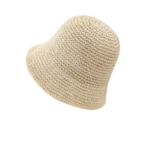 Chic woven straw bucket hat for women featuring a minimalist beige sunshade design