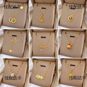 Set of 9 gold titanium steel necklaces with various pendants in jewelry boxes
