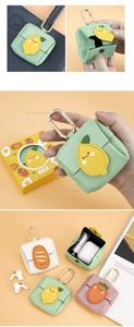 Detailed view of microfiber leather mini pouch with cartoon patches and metal buckle