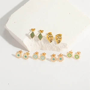 Set of 6 pairs of gold gear and evil eye stud earrings with colorful gemstones