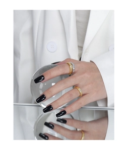 Detail of silver and gold rings with tin foil texture and sparkling zircon stones