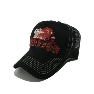 Detailed embroidery of bull and STATION lettering on a retro mesh trucker hat