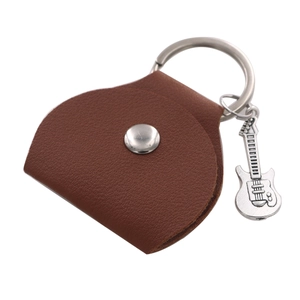 Close-up of brown leather guitar pick holder keychain with metal guitar charm detail