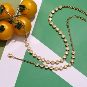 Golden stainless steel tennis necklace and bracelet set with cubic zirconia stones