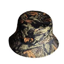 Detail of the leaf camouflage pattern on a dark cotton bucket hat for outdoor sun protection