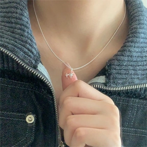 Close-up of 925 sterling silver star pendant necklace on minimalist beaded chain