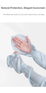 Detail view of light blue 100% mulberry silk sun sleeves with thumb holes for UV protection