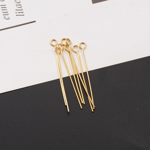 Detail of golden stainless steel eye pins for DIY jewelry making and handmade beading