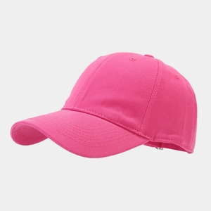 Detail view of the rose pink cotton baseball cap highlighting stitching and vent holes