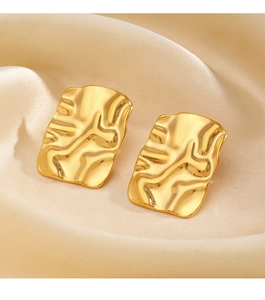 Macro detail of 18K gold plated geometric rectangular earrings with crinkle texture
