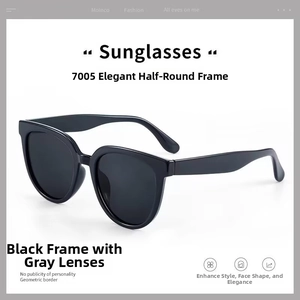 Detail of glossy black geometric frames and gray lenses of these retro oval sunglasses