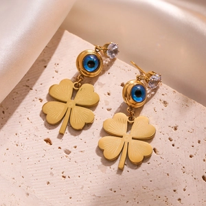 Gold clover earrings featuring blue evil eye beads and clear zircon studs on stone
