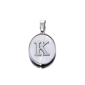 Detail shot of a 22mm silver oval pendant with mother of pearl and letter K