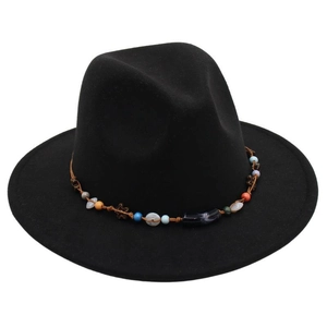 Detail of black wool fedora hat featuring a bohemian colorful beaded braided band decoration