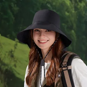 Women's wide brim sun hat in black with chin strap for outdoor hiking and UV protection