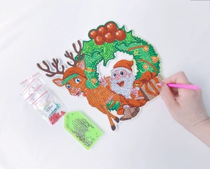Close-up of DIY 5D Christmas wreath diamond painting kit with Santa and reindeer