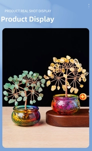 Macro detail of natural citrine and aventurine crystal money trees on ornate glass bases