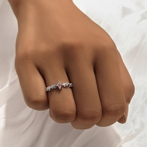 Detail of 925 silver ring featuring a pink marquise-cut gem and pavé star accents