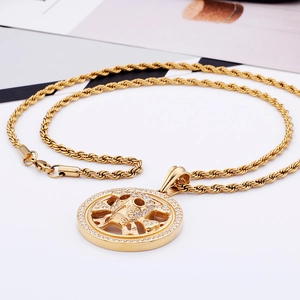 Macro detail of gold plated hip hop skull pendant with inlaid small diamonds on rope chain