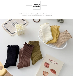 Close-up of cotton socks with ruffled edges and ribbed texture in diverse autumn colors