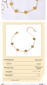 Detail of gold titanium steel bracelet featuring hollow tree and flower charms