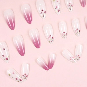 Pink gradient and white floral almond press-on nails set with glossy polished finish