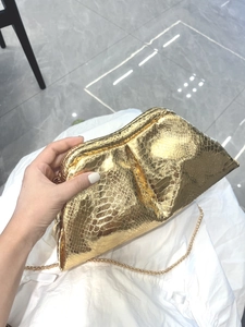 Elegant gold snakeskin cloud clutch bag with metallic chain strap for evening party