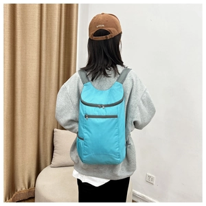 Lake blue foldable backpack with breathable mesh straps and water-resistant nylon fabric