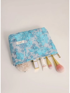 Floral embroidered makeup bag with blue jacquard pattern and large capacity for toiletries