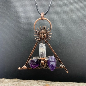Antique bronze triangle sun pendant with white crystal pillar and raw amethyst stones