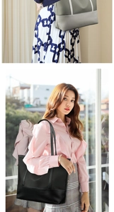Detailed view of large Oxford cloth tote bag with reinforced leather handles in two colors