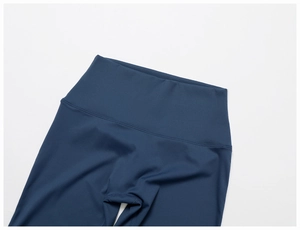 Detail of high-waist navy yoga leggings with premium stitching and elastic texture