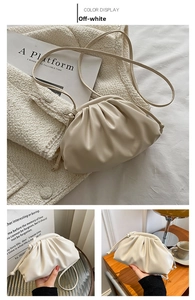 Detail of off-white cloud pouch bag featuring premium pleated soft leather and clasp closure