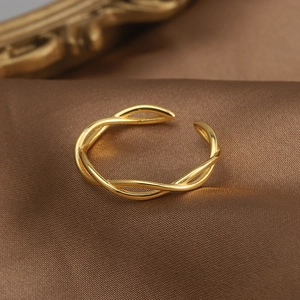 Elegant minimalist S925 sterling silver twisted open ring with a gold finish and silk texture