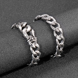 Silver stainless steel Cuban chain bracelet with intricate snake scale texture for men